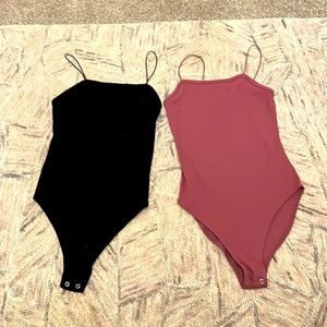 Black and purple spaghetti strap bodysuits